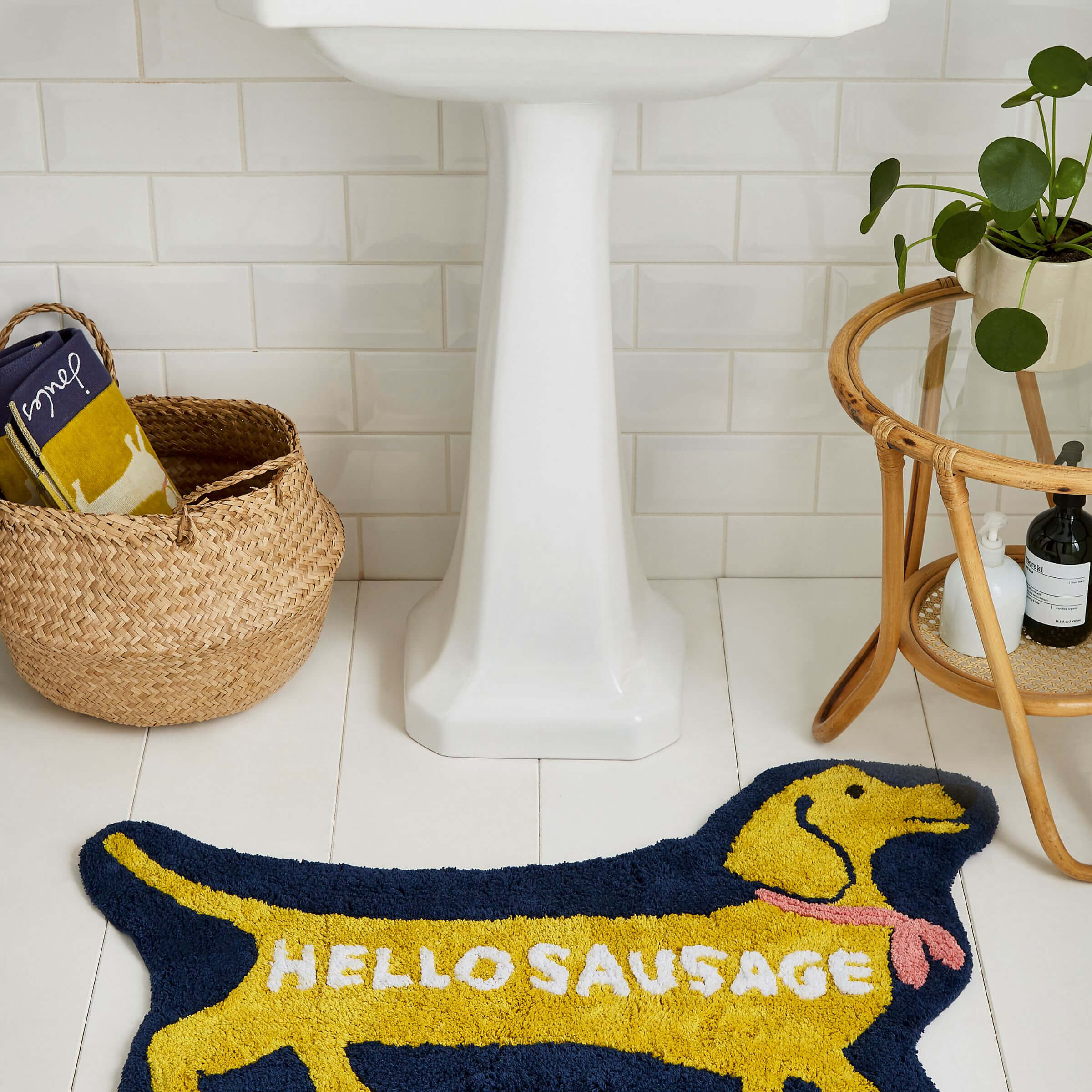 Product photograph of Joules Sausage Dogs Bath Mat Gold from Bedeck Home.