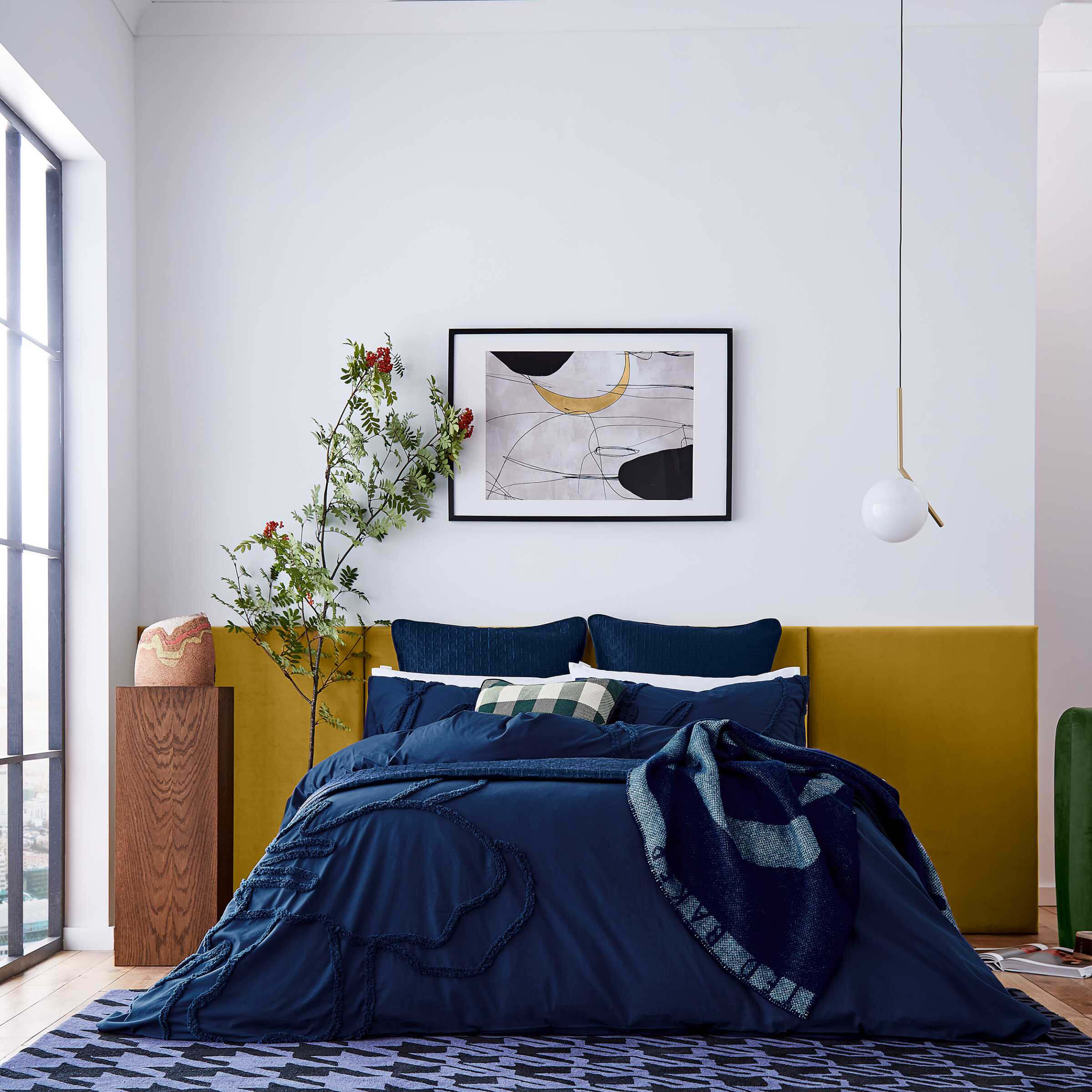 Tufted blue deals bed